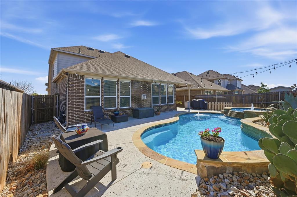 824 Pinnacle Ridge Road Fort Worth, TX 76052 - Photo 39 of 40 a view of a house with backyard porch and sitting area