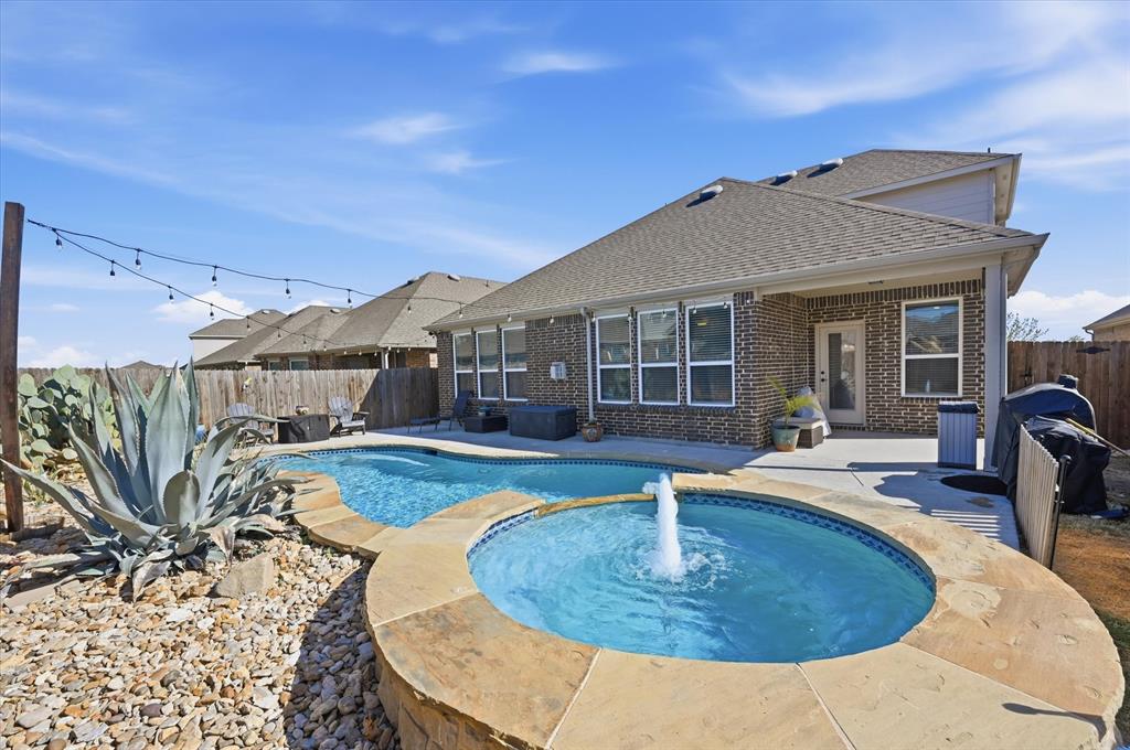 824 Pinnacle Ridge Road Fort Worth, TX 76052 - Photo 4 of 40 a view of a house with backyard porch and sitting area