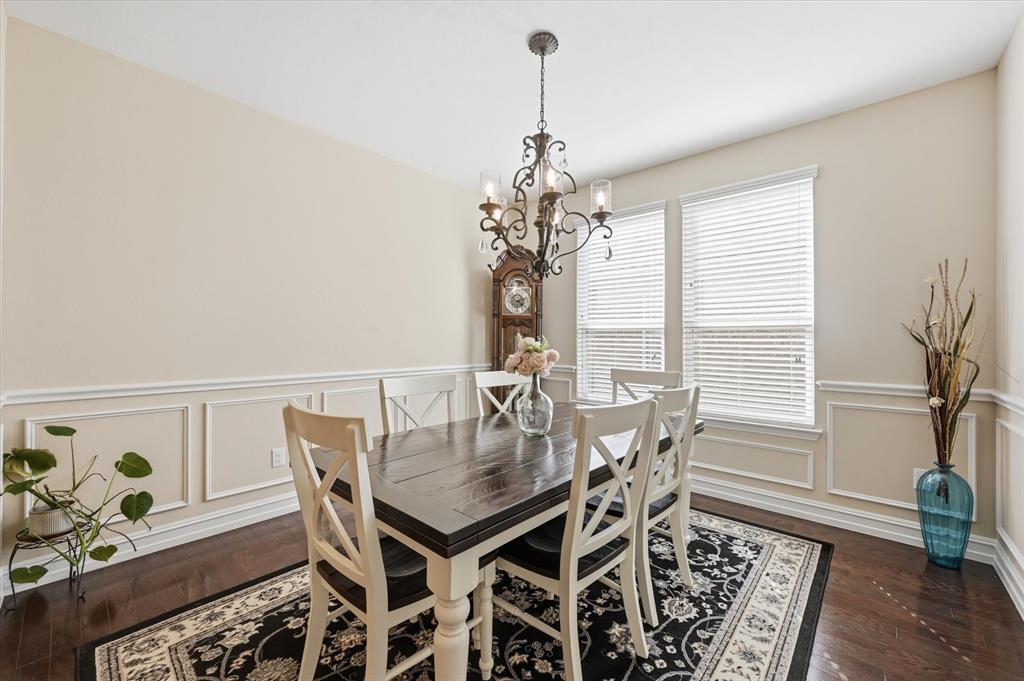 824 Pinnacle Ridge Road Fort Worth, TX 76052 - Photo 7 of 40 a view of a dining room with furniture and a chandelier