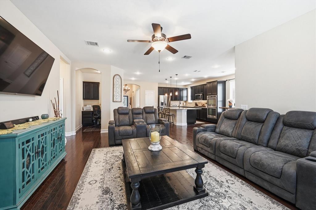 824 Pinnacle Ridge Road Fort Worth, TX 76052 - Photo 8 of 40 a living room with furniture fireplace and a flat screen tv