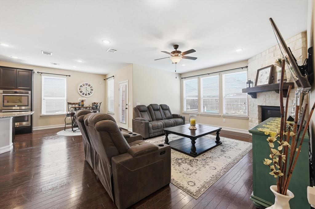 824 Pinnacle Ridge Road Fort Worth, TX 76052 - Photo 10 of 40 a living room with fireplace furniture and a wooden floor