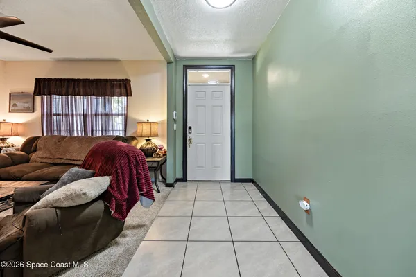 a bed room with a bed and a window