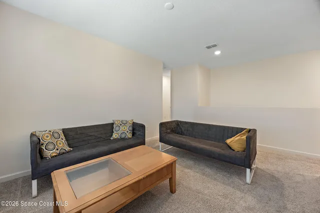 a living room with furniture and a couch