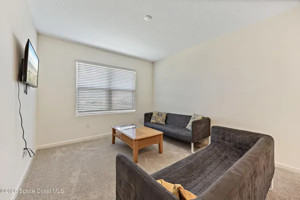 a living room with furniture and a window