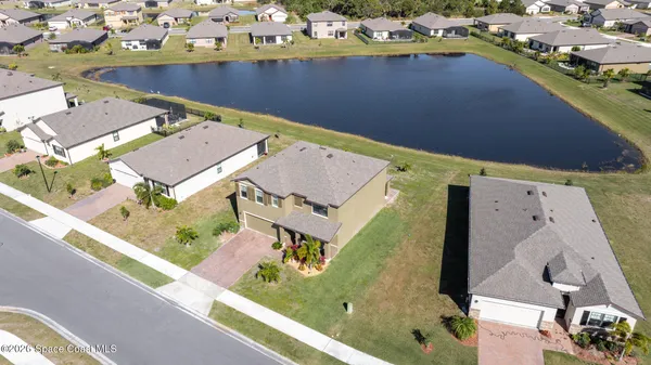 an aerial view of a house with a outdoor space