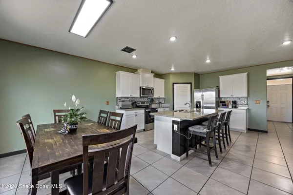 a view of a dining room with furniture