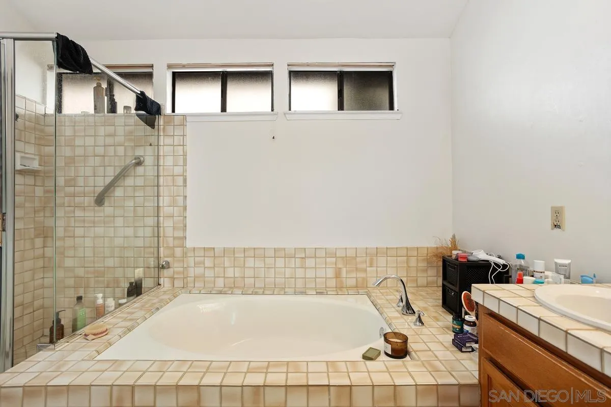 15089 Tierra Alta Del Mar, CA 92014 - Photo 15 of 25 a bathroom with a bathtub and sink