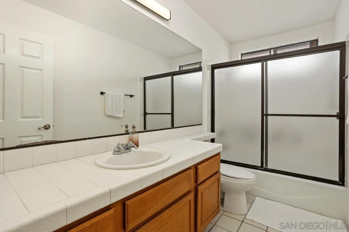 15089 Tierra Alta Del Mar, CA 92014 - Photo 18 of 25 a bathroom with a sink and a mirror