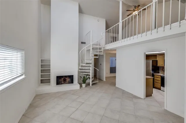 a view of livingroom with furniture and a fireplace