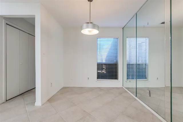 a view of a room with windows and closet