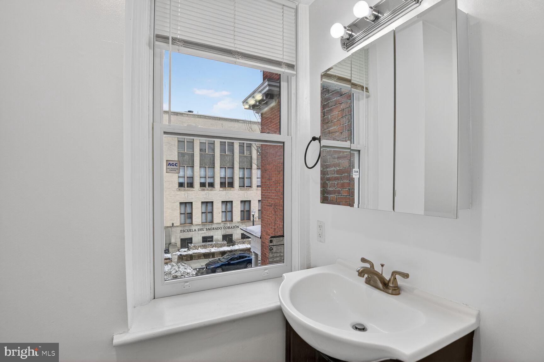 1648 Park Road Northwest, Unit 5 Washington, DC 20010 - Photo 14 of 15 a bathroom with a bathtub and a sink
