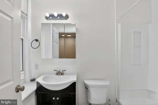 a bathroom with a sink and a toilet
