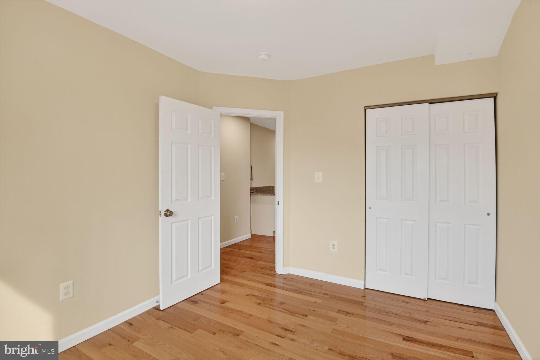 1648 Park Road Northwest, Unit 5 Washington, DC 20010 - Photo 10 of 15 a view of an empty room with wooden floor