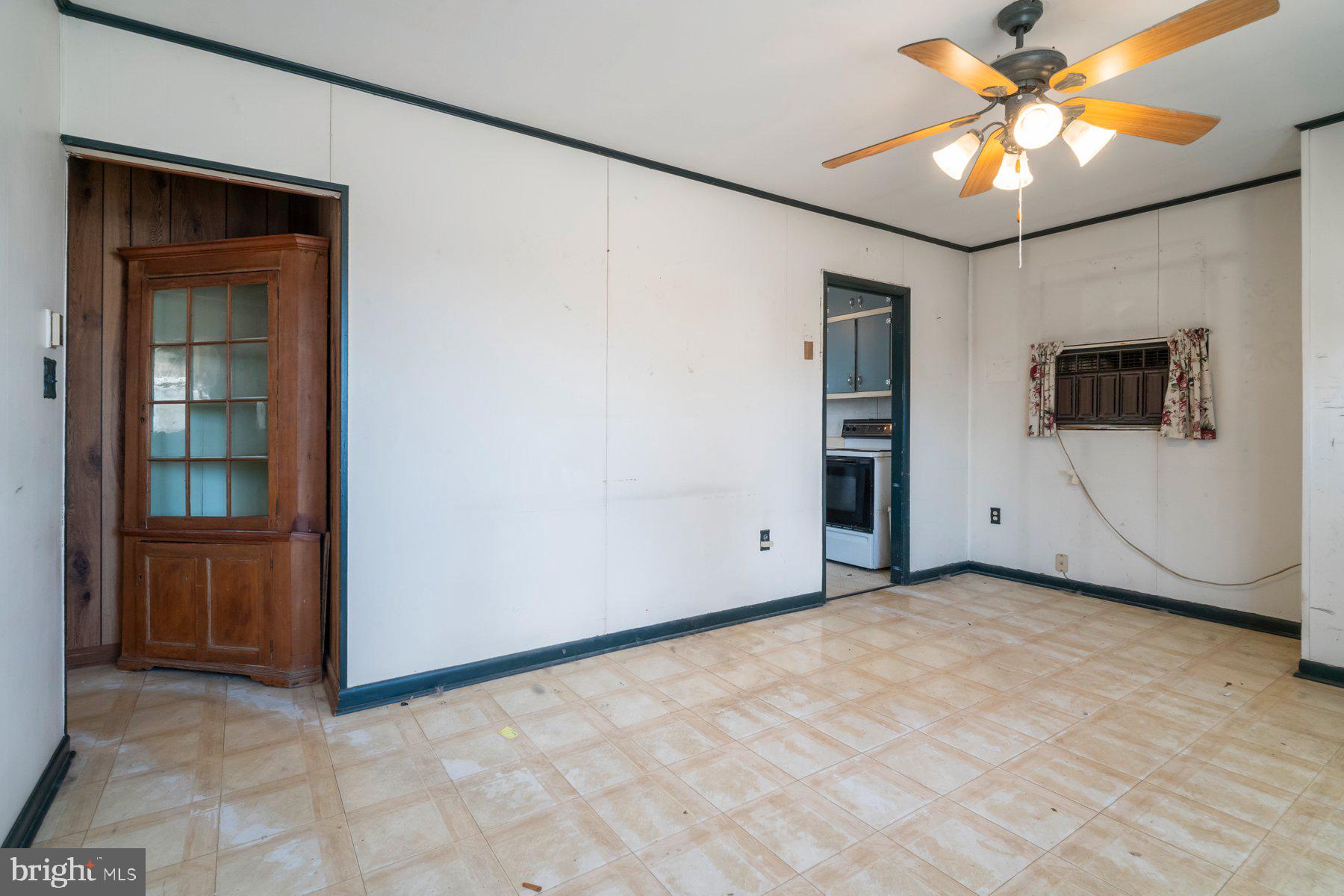 23 Commerce Street Taneytown, MD 21787 - Photo 12 of 18 an empty room with closet and a chandelier fan