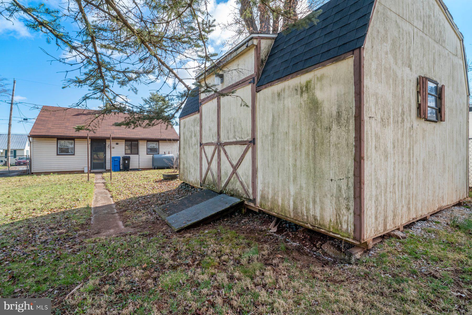23 Commerce Street Taneytown, MD 21787 - Photo 14 of 18 a front view of a house with a yard