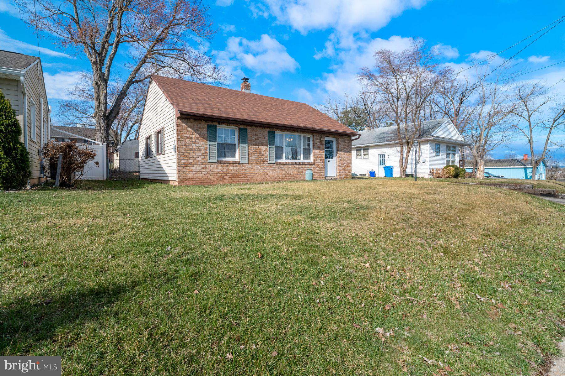 23 Commerce Street Taneytown, MD 21787 - Photo 17 of 18 a view of a house with a large tree and a big yard