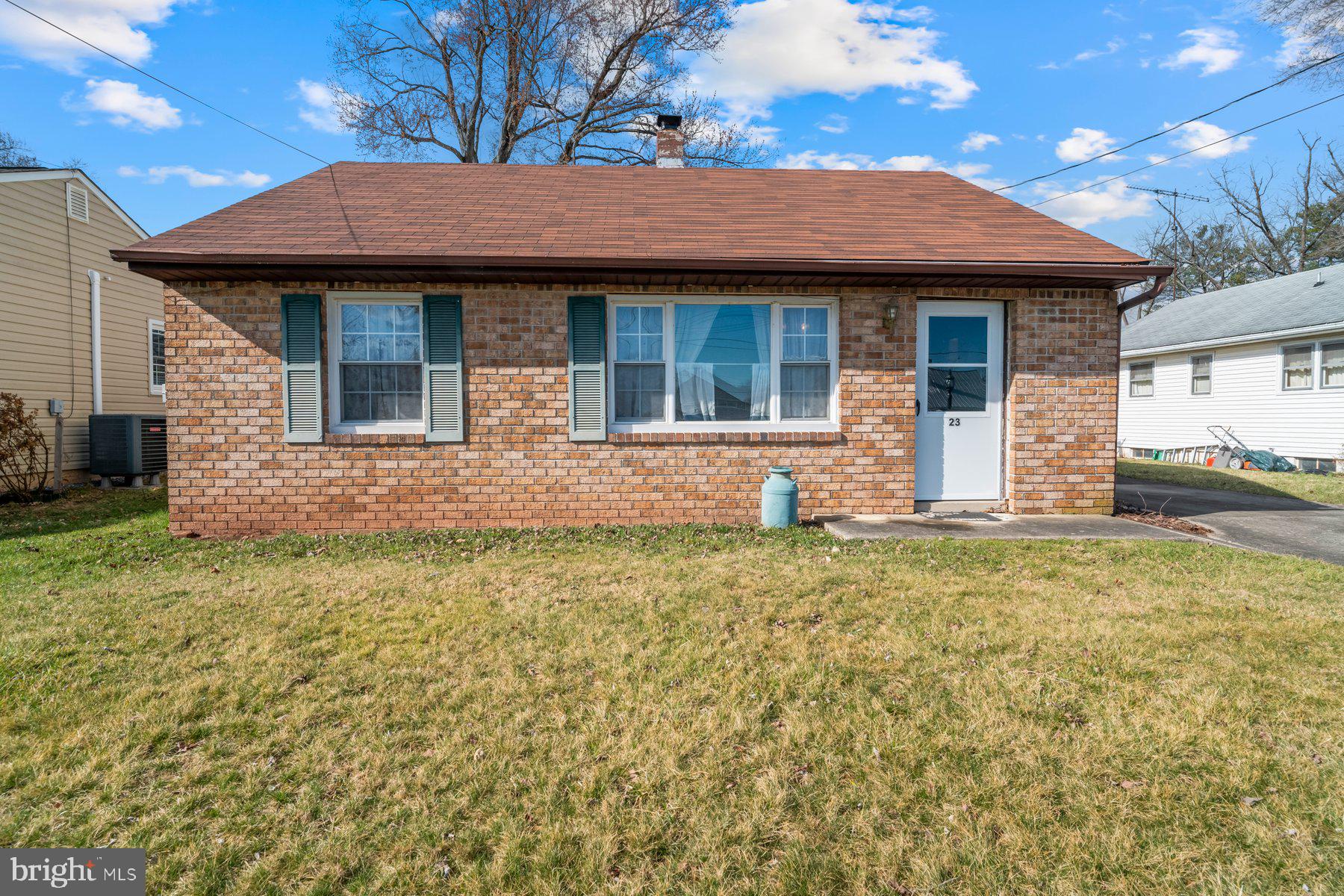 23 Commerce Street Taneytown, MD 21787 - Photo 18 of 18 a front view of a house with a garden