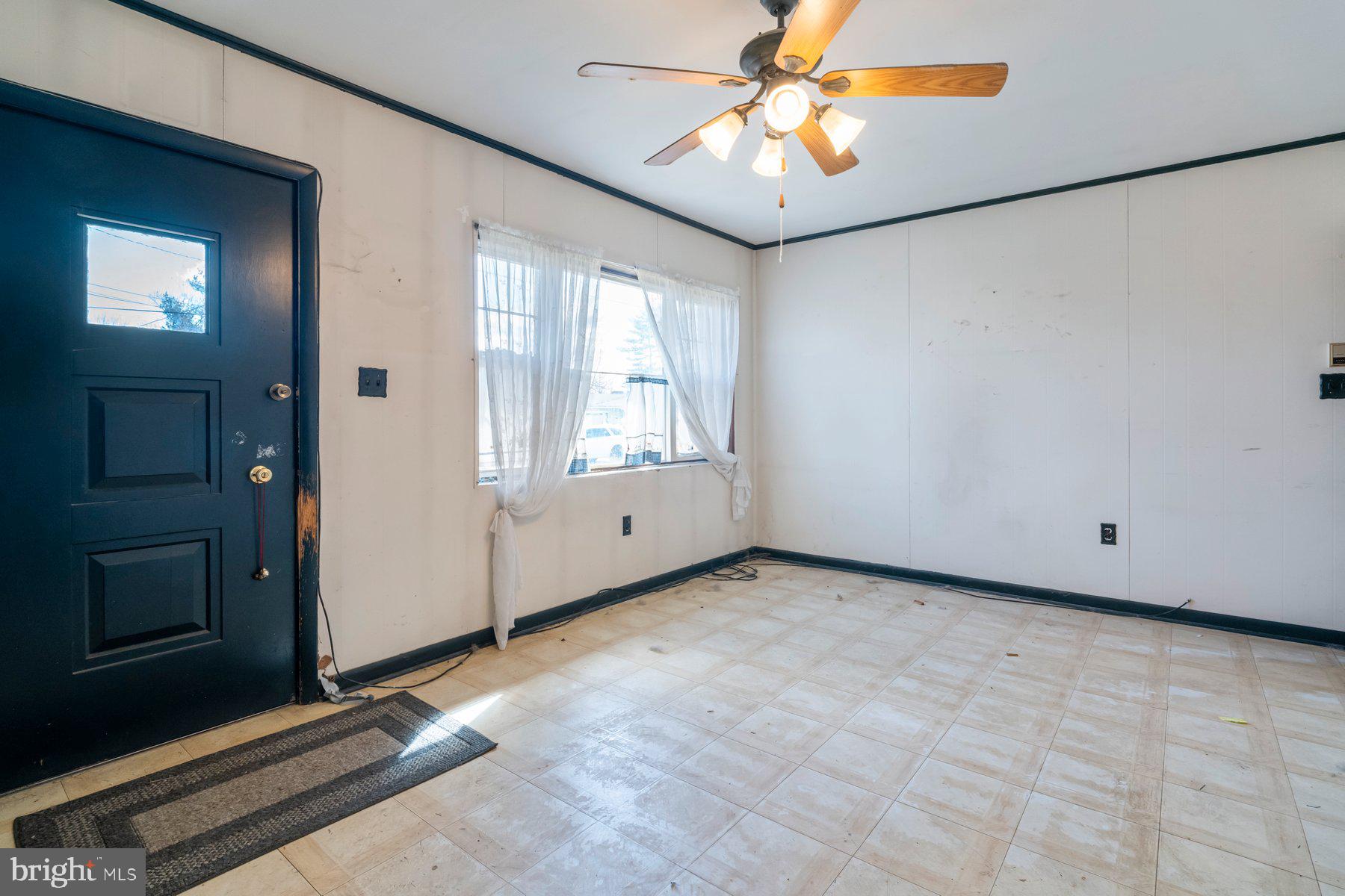 23 Commerce Street Taneytown, MD 21787 - Photo 4 of 18 a view of an empty room with a window