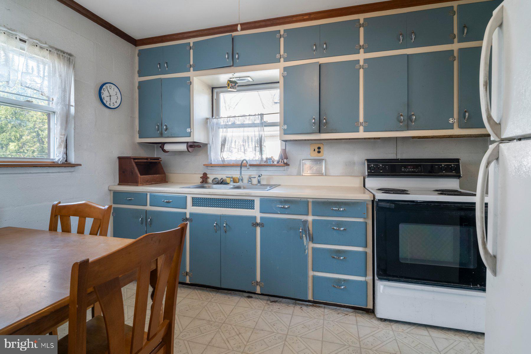 23 Commerce Street Taneytown, MD 21787 - Photo 6 of 18 a kitchen with stainless steel appliances granite countertop a stove a sink and a microwave