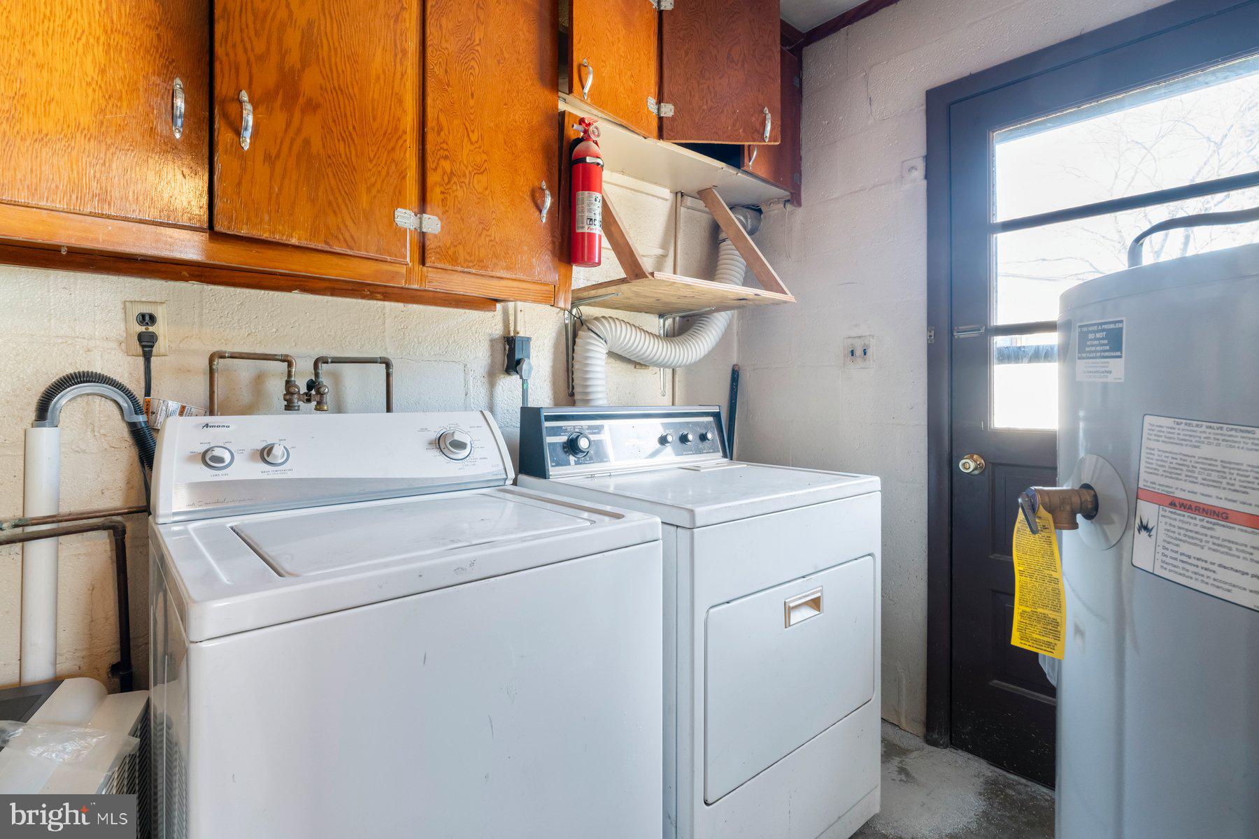 23 Commerce Street Taneytown, MD 21787 - Photo 7 of 18 a utility room with dryer and washer