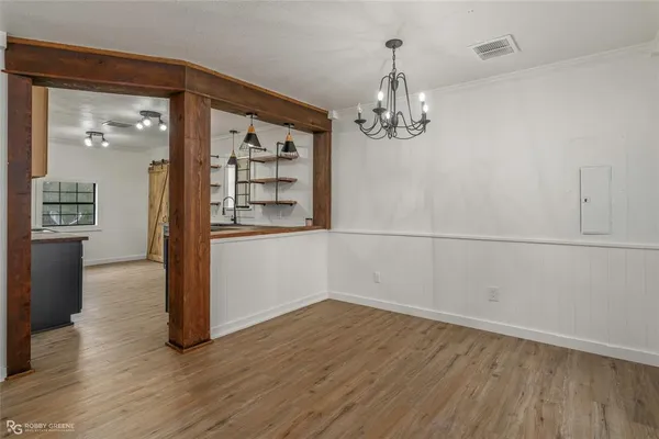 a kitchen with counter top space cabinets and window