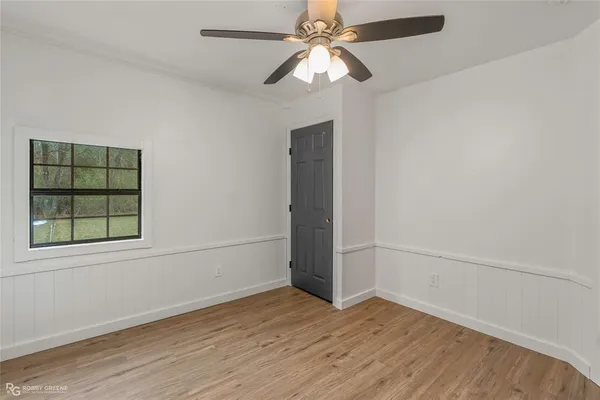 a bathroom with a double vanity sink a toilet and a mirror