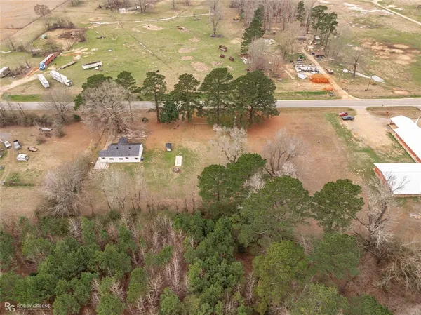 a front view of house with yard and trees