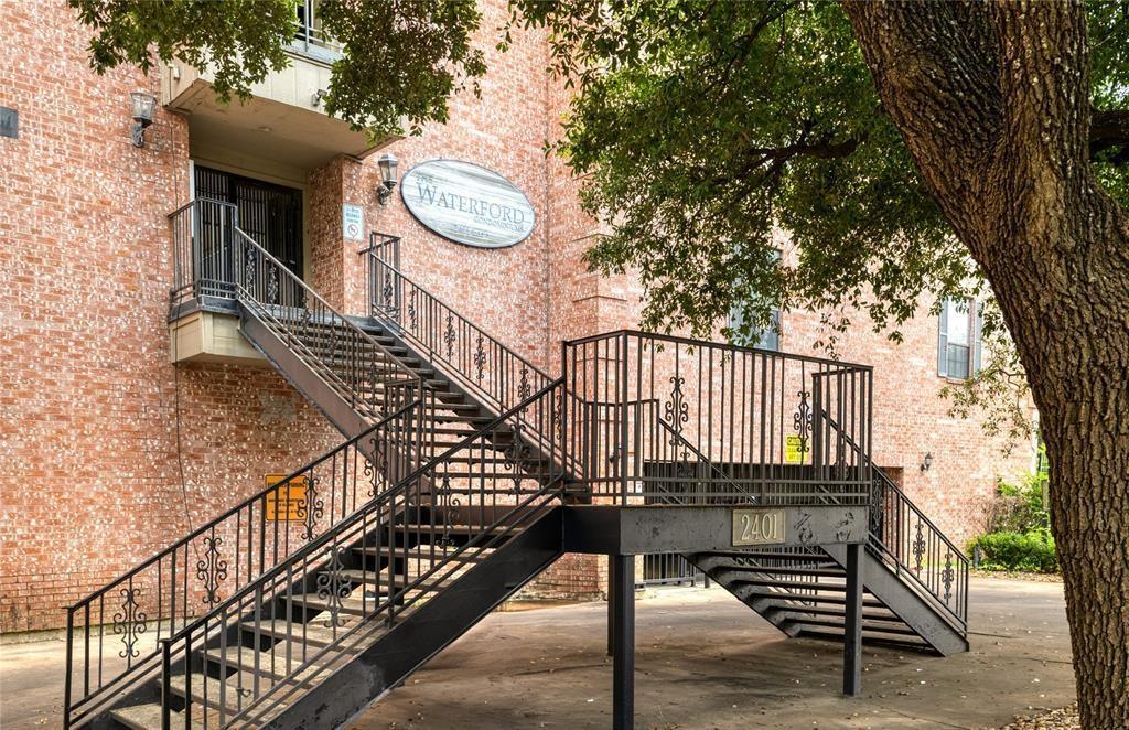 a view of staircase with a small deck
