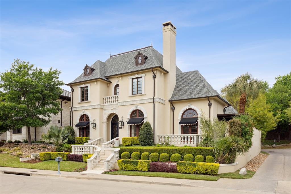 7151 Hill Forest Drive Dallas, TX 75230 - Photo 1 of 40 a front view of a house with garden