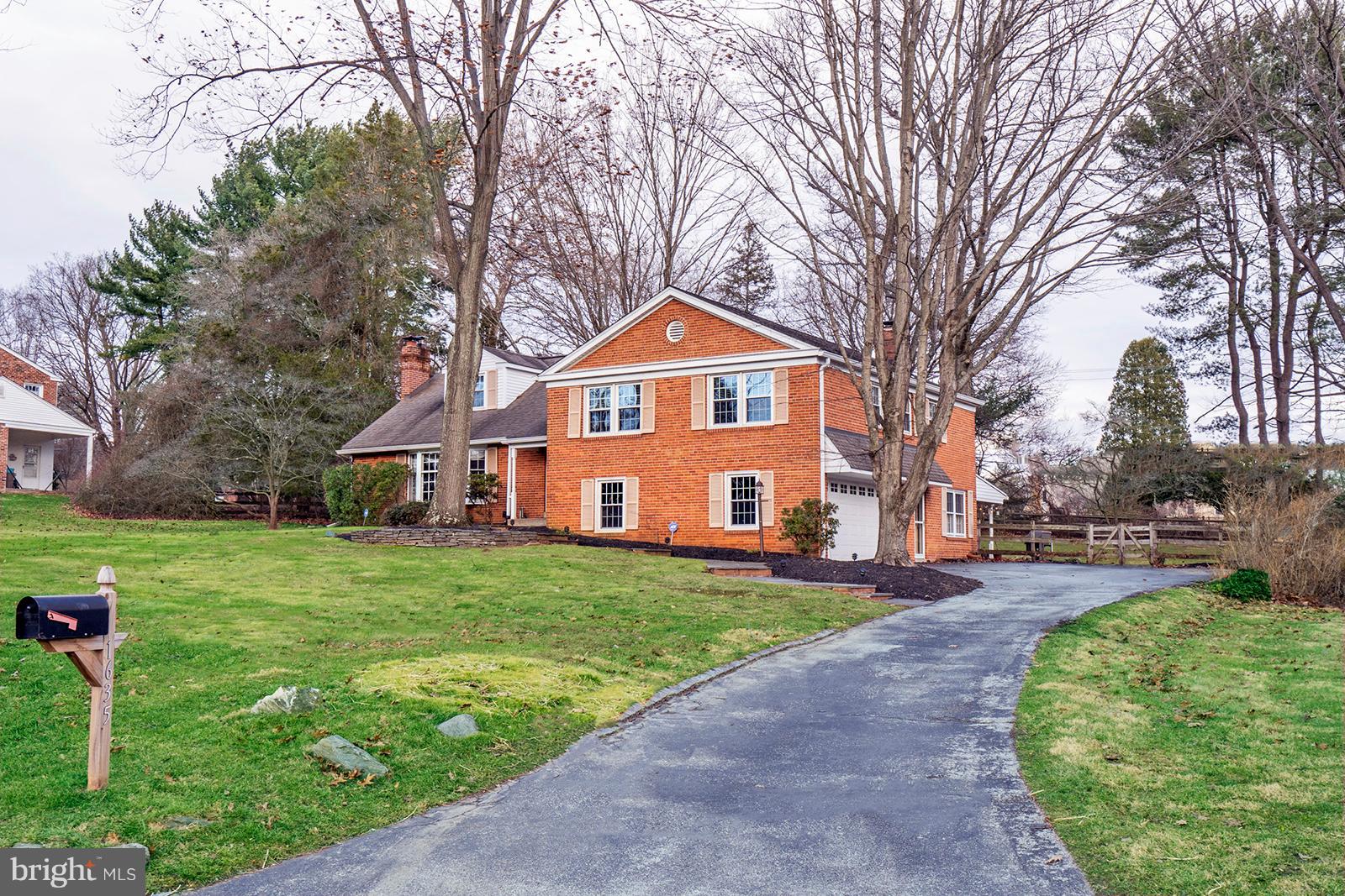 Exterior front w/private drive leading to garage