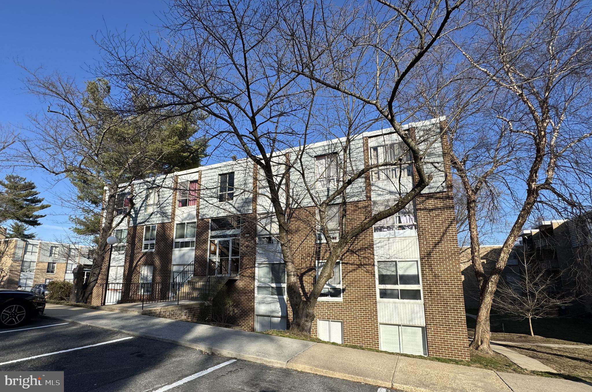 3936 Bel Pre Road, Unit 39362 Silver Spring, MD 20906 - Photo 1 of 32 a view of a building with a street