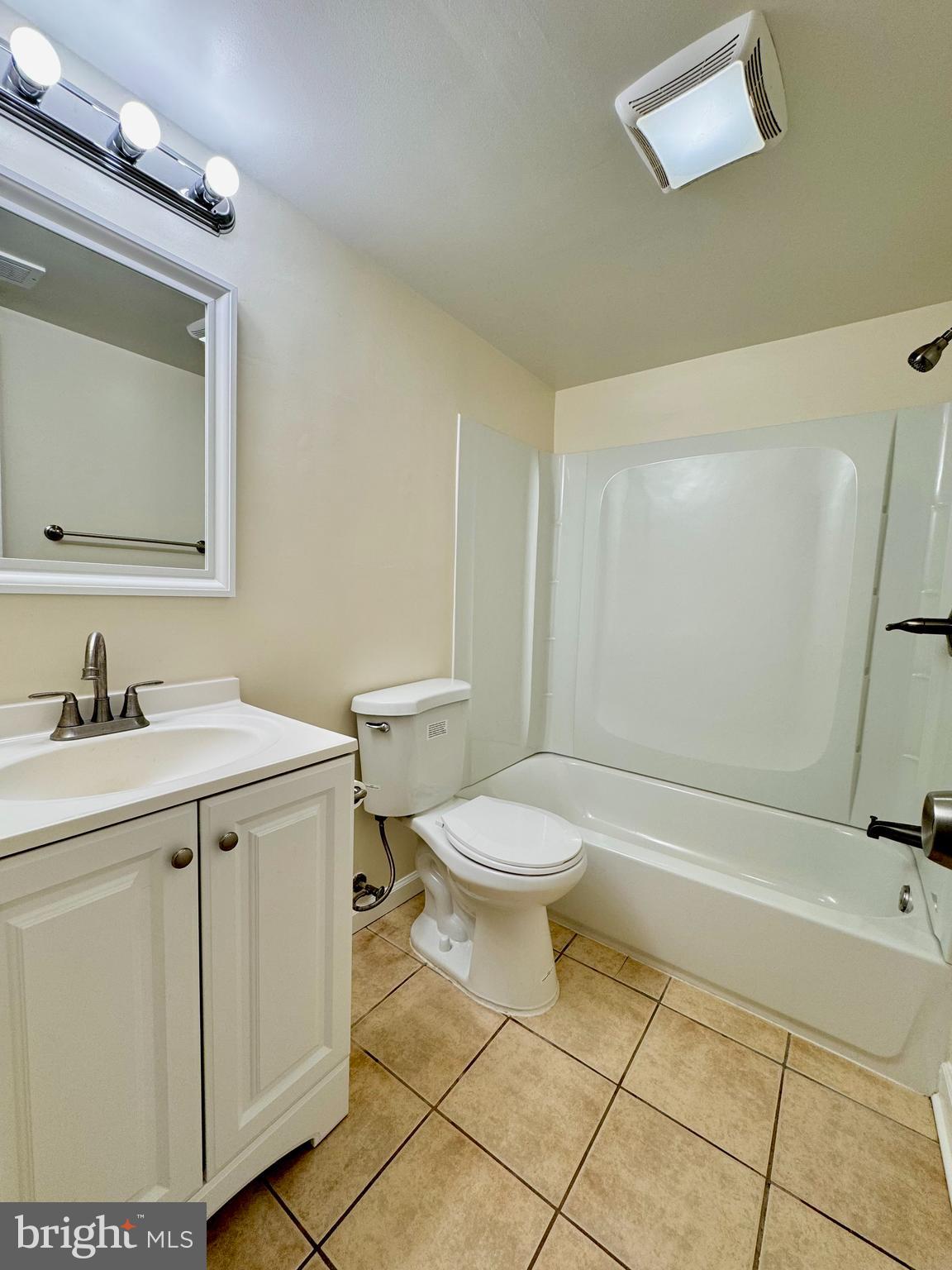 3936 Bel Pre Road, Unit 39362 Silver Spring, MD 20906 - Photo 20 of 32 a bathroom with a sink a toilet and a mirror