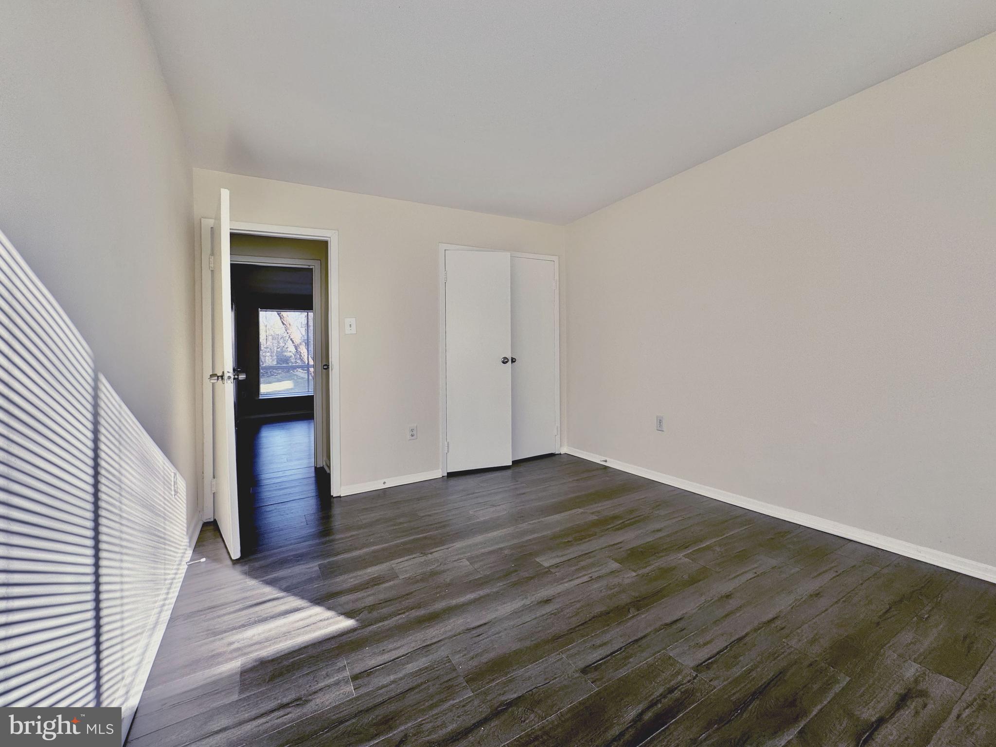 3936 Bel Pre Road, Unit 39362 Silver Spring, MD 20906 - Photo 23 of 32 wooden floor in an empty room