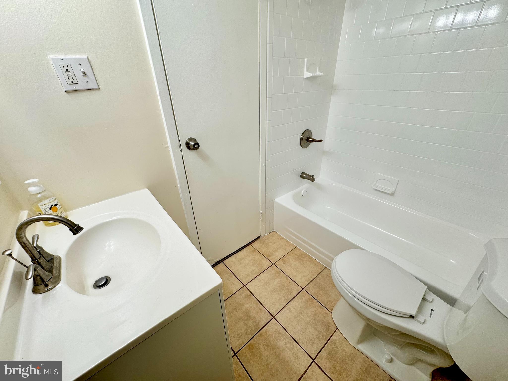 3936 Bel Pre Road, Unit 39362 Silver Spring, MD 20906 - Photo 25 of 32 a bathroom with a sink toilet and shower