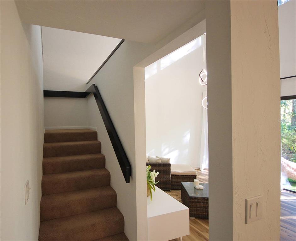 315 Southwest 54th Drive Gainesville, FL 32607 - Photo 13 of 36 a view of entryway and hall with wooden floor