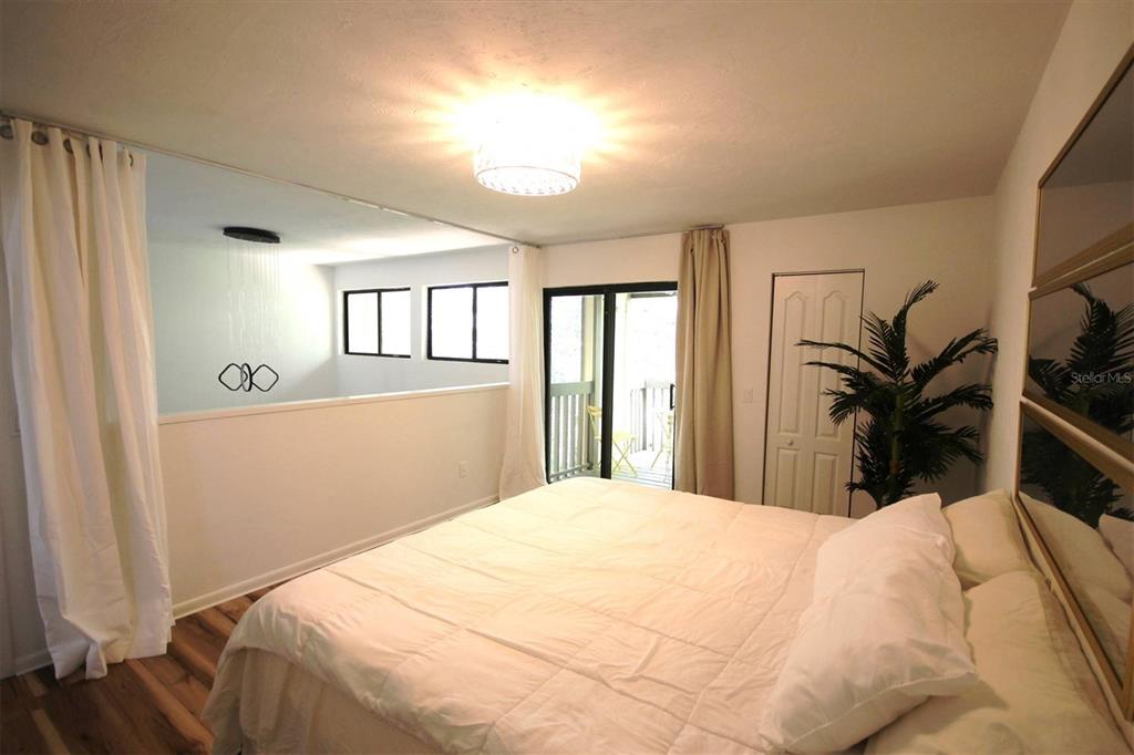 315 Southwest 54th Drive Gainesville, FL 32607 - Photo 17 of 36 a bedroom with a large bed and a window