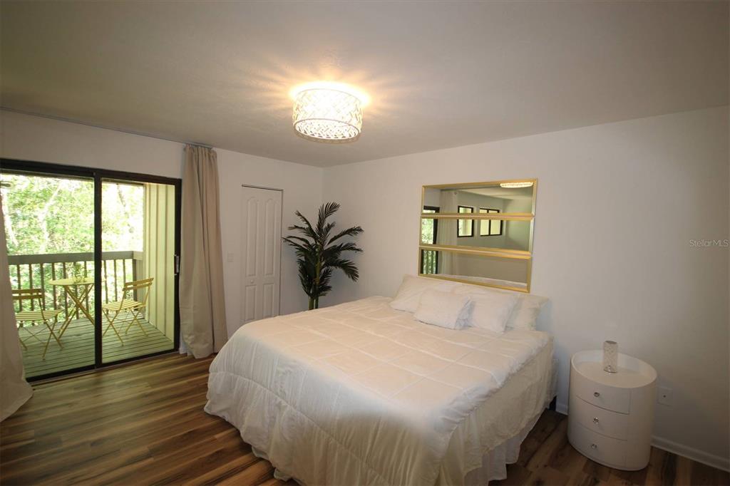 315 Southwest 54th Drive Gainesville, FL 32607 - Photo 19 of 36 a bedroom with a bed and a large window