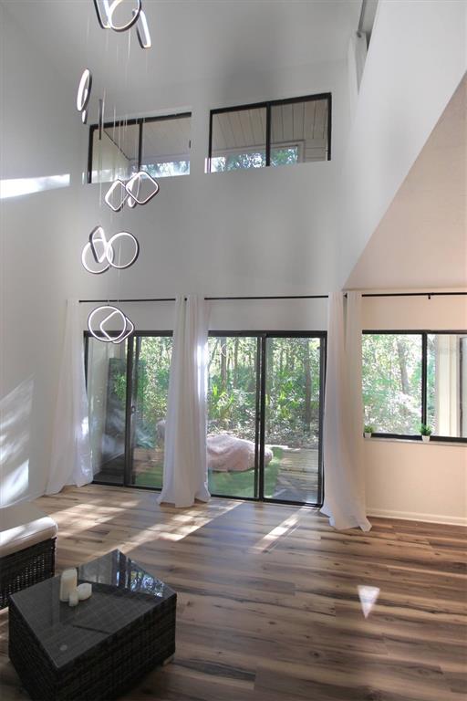 315 Southwest 54th Drive Gainesville, FL 32607 - Photo 3 of 36 a view of a livingroom with furniture wooden floor and windows