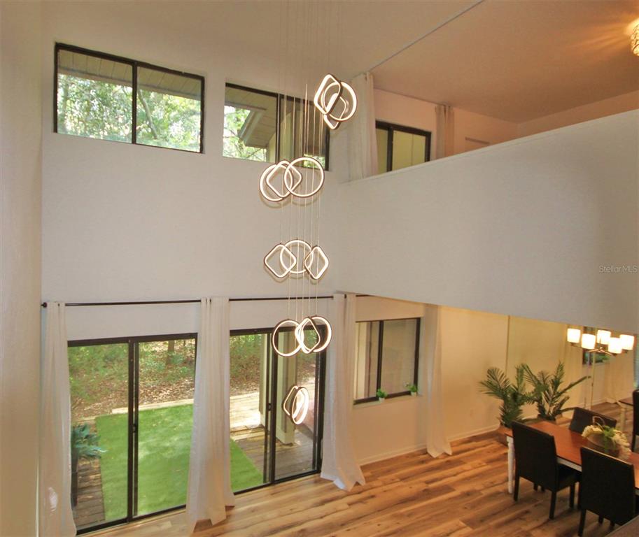 315 Southwest 54th Drive Gainesville, FL 32607 - Photo 34 of 36 a view of a hallway with wooden floor and windows