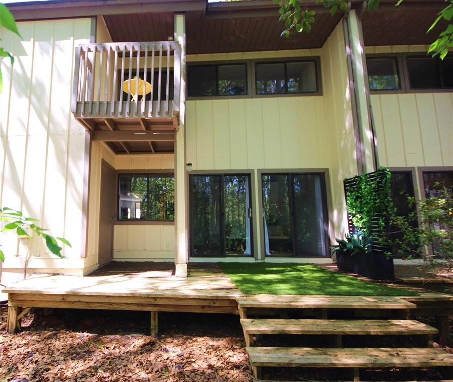 315 Southwest 54th Drive Gainesville, FL 32607 - Photo 35 of 36 a view of a house with a yard and sitting area