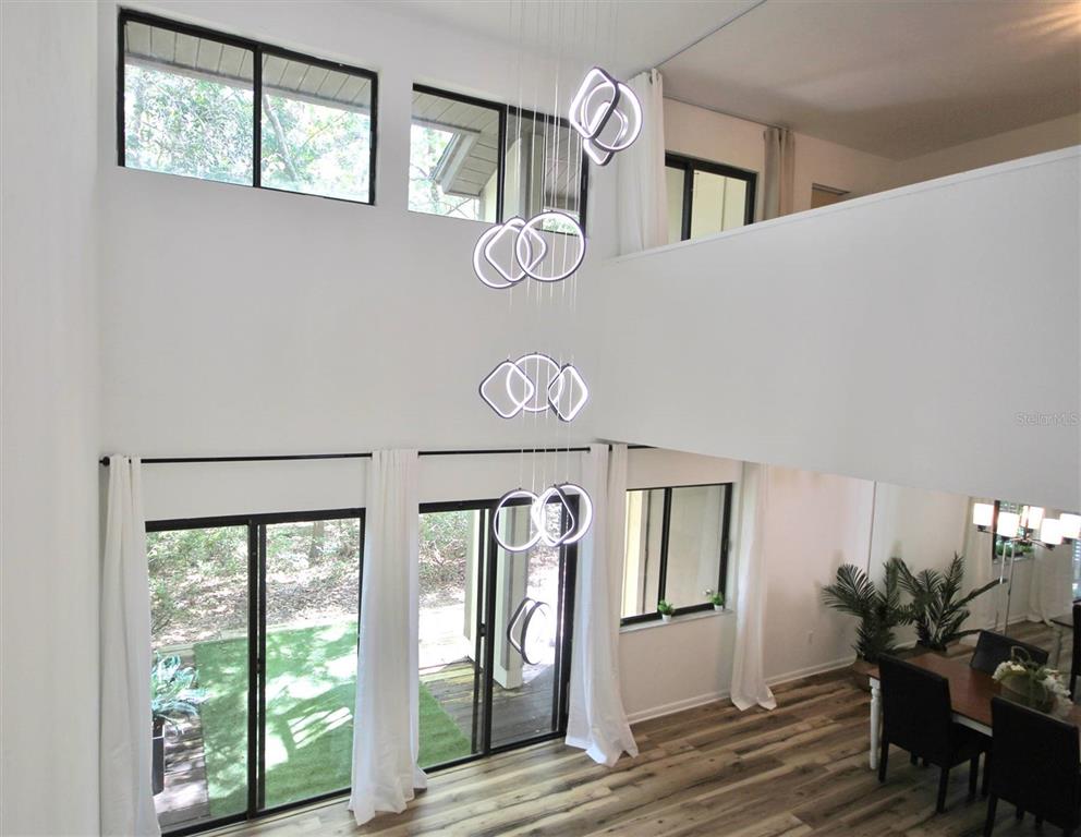 315 Southwest 54th Drive Gainesville, FL 32607 - Photo 6 of 36 a front view of a house with wooden floor and windows