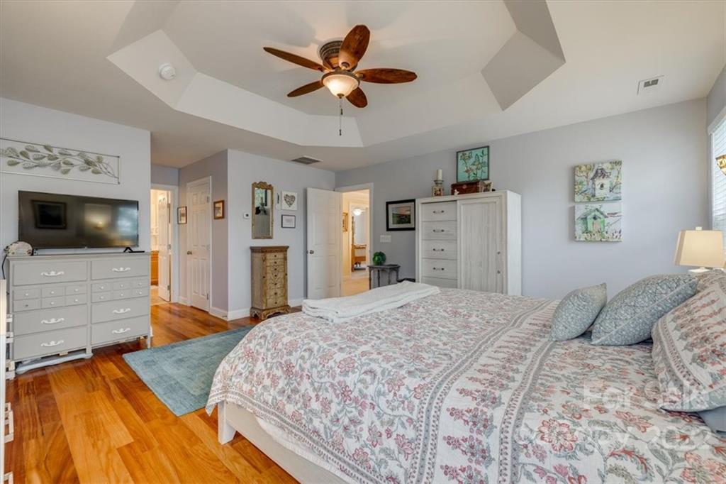 2309 Harvester Avenue Fort Mill, SC 29708 - Photo 32 of 47 a bedroom with a bed and a flat screen tv