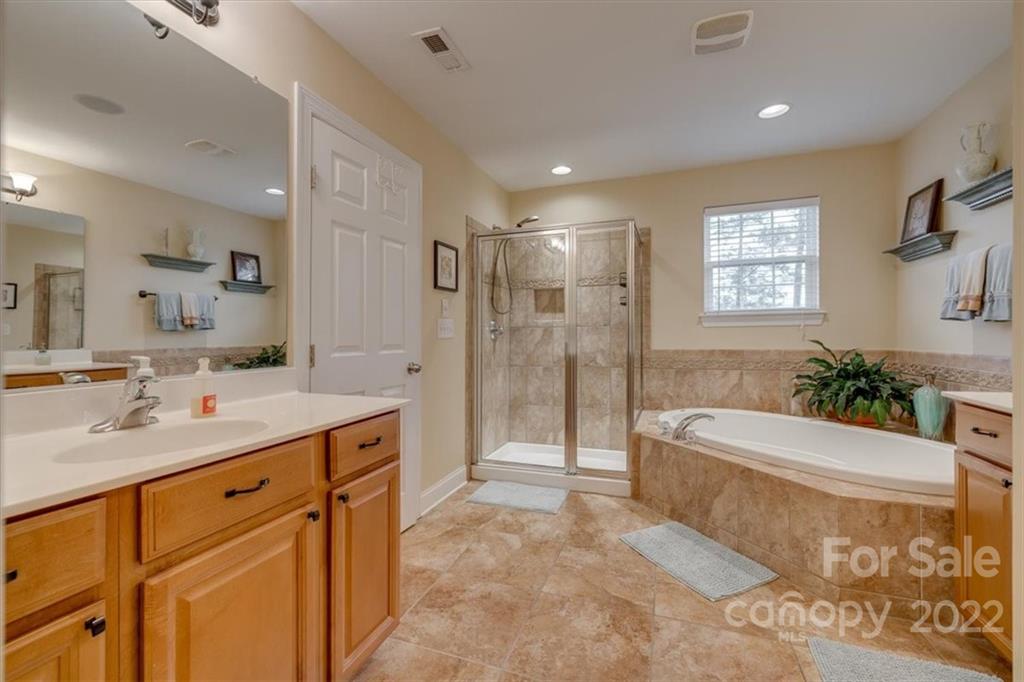 2309 Harvester Avenue Fort Mill, SC 29708 - Photo 36 of 47 a spacious bathroom with a bathtub shower sink mirror and toilet