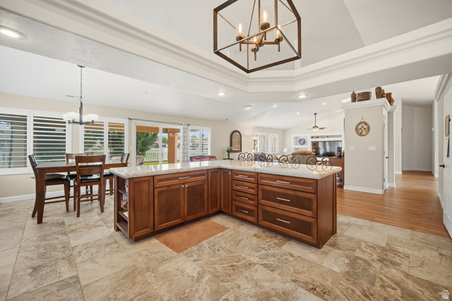 1985 West Rivers Edge Lane St. George, UT 84770 - Photo 42 of 42 Kitchen featuring hanging lights, light stone countertops, open floor plan, a spacious island, and open shelves