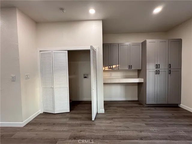 a view of kitchen with refrigerator and window