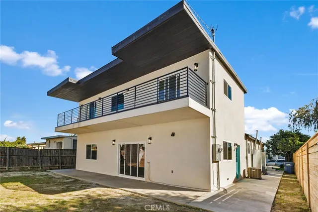 a view of house with swimming pool and porch