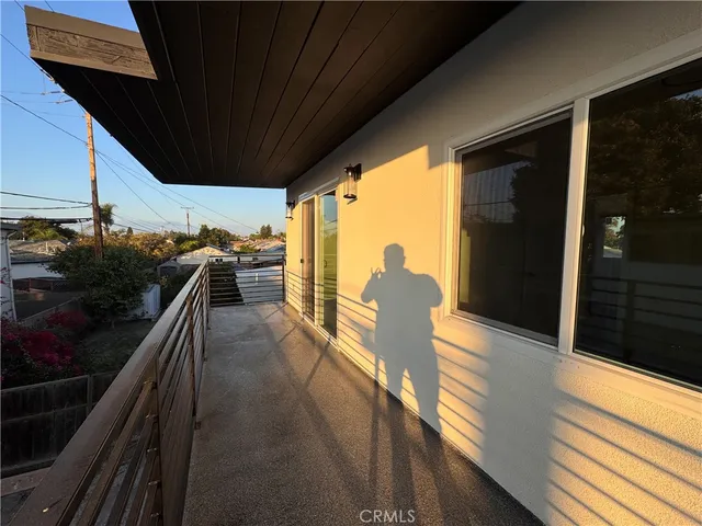 a view of balcony with furniture