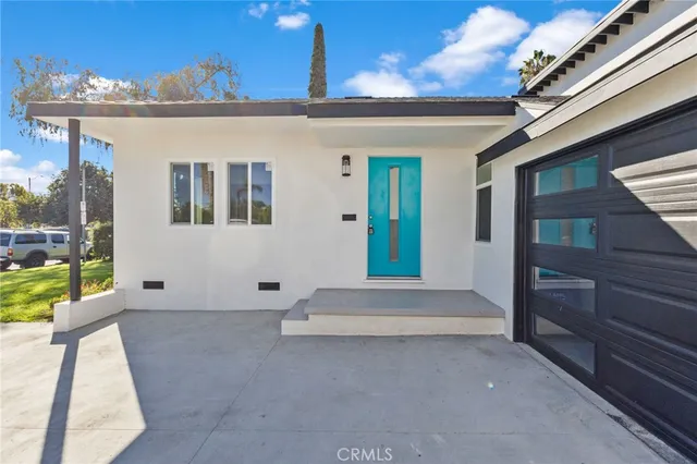 a view of patio with a table and chairs