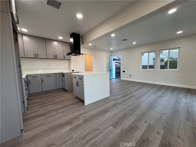 a view of kitchen with cabinets and wooden floor