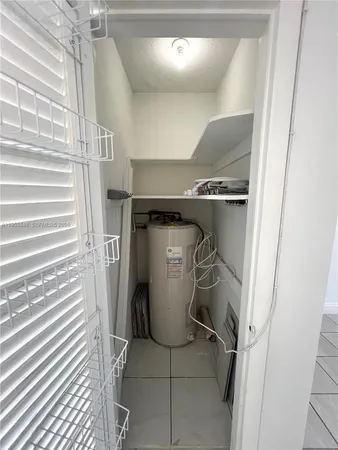 a bathroom with a toilet a sink a mirror and a bathtub